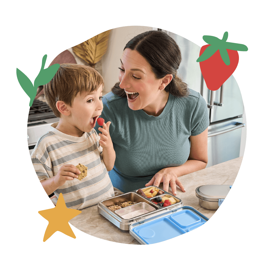 Mother and child using Good Bare stainless steel lunch box at kitchen table, non-toxic and BPA-free