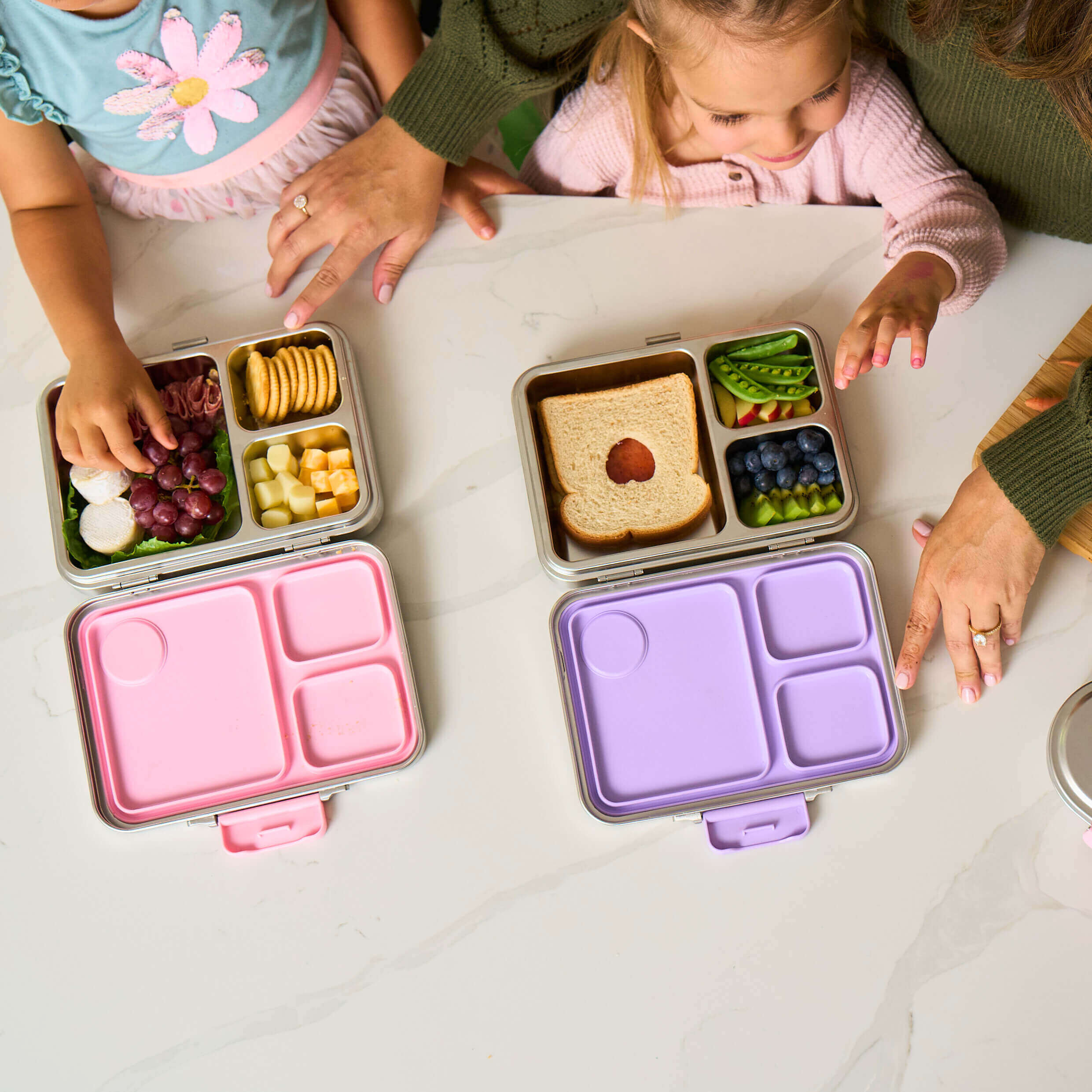 Family prepare lunch for school using Good Bare stainless steel lunch box