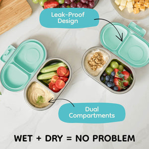 Stainless steel snack container with two divided compartments on a table, labeled for leak-proof design and dual compartments.