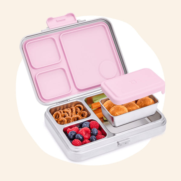 Pink and stainless steel bento box with compartments filled with fresh food